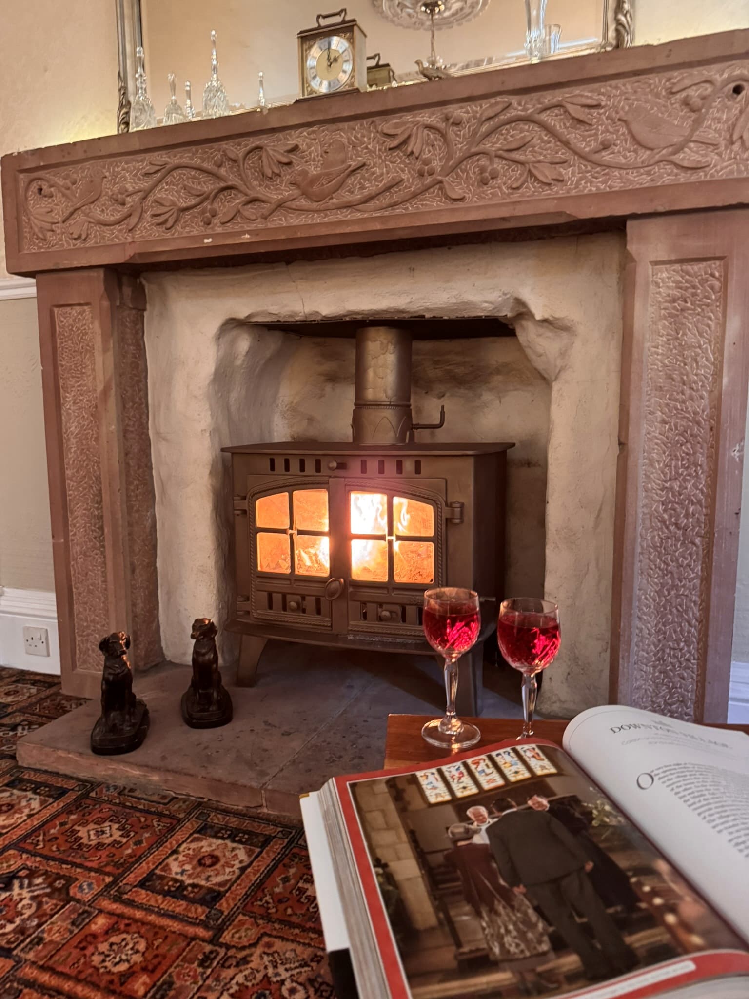 Wood-burning stove and carved fireplace inside Meikle Richorn